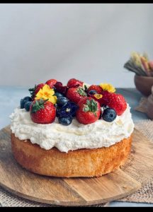 Vanilla Cake With Strawberries And Whipped Cream